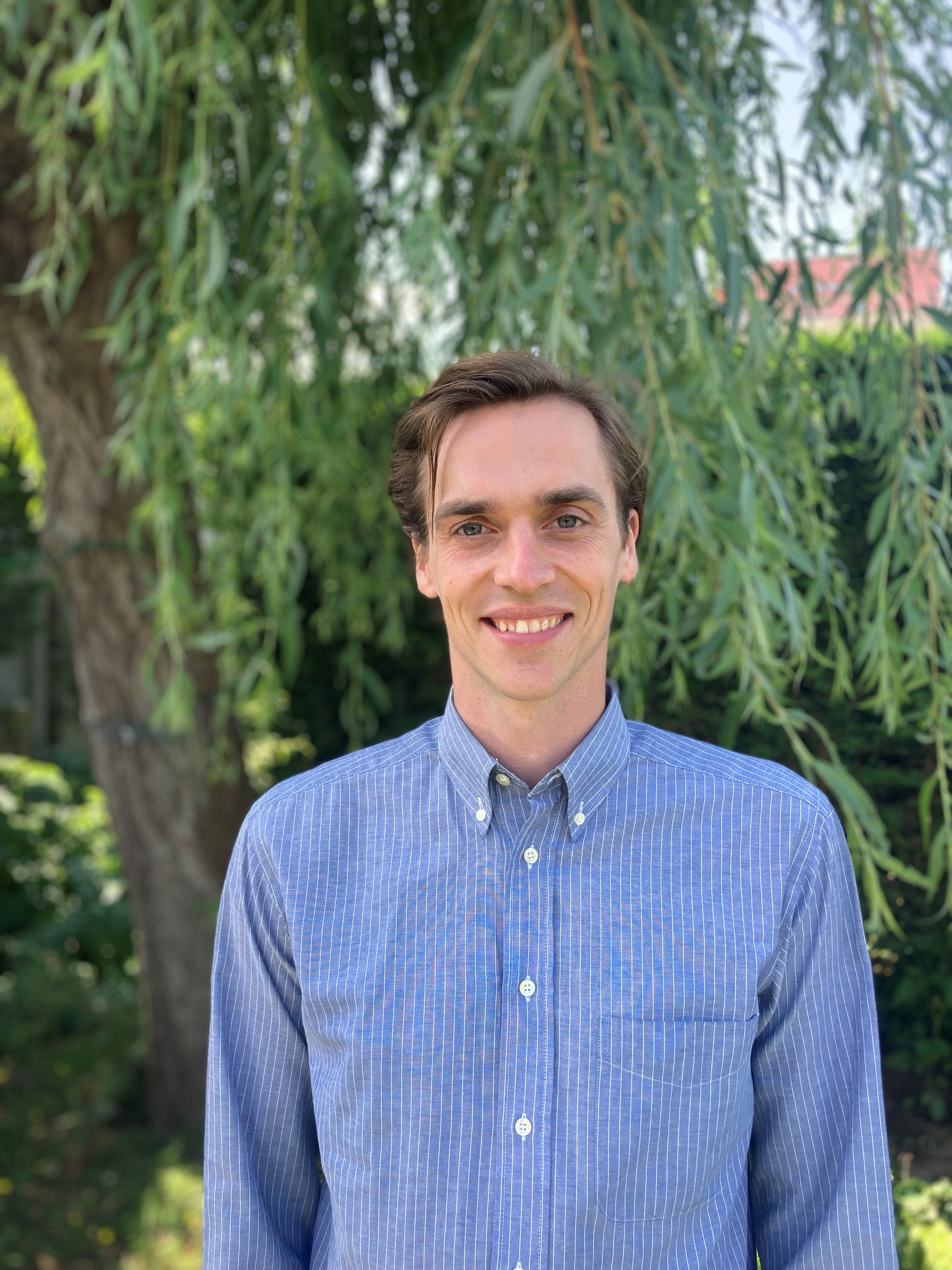 portrait image of Brandon Muilenberg smiling in outdoor setting