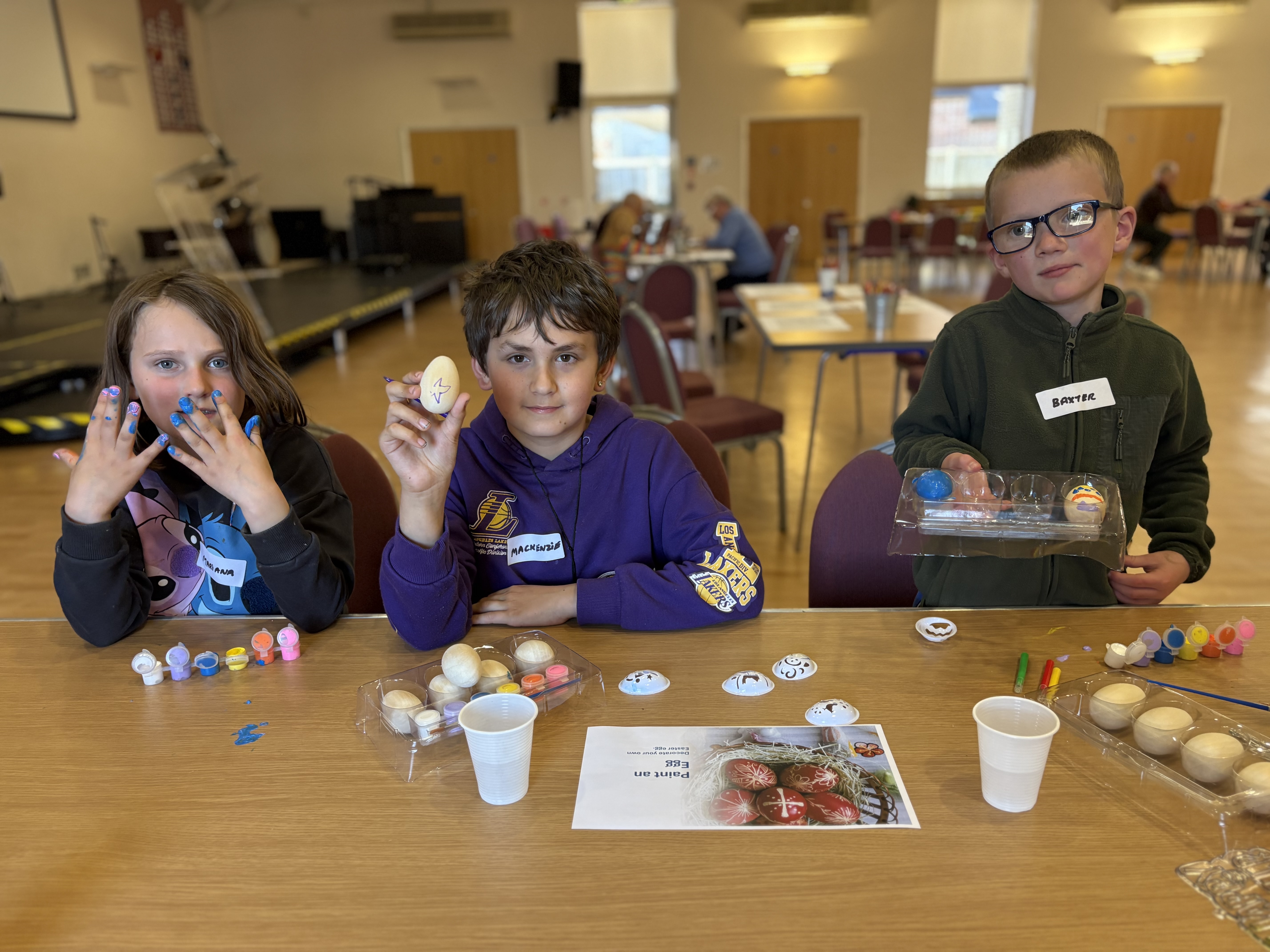 Children decorating eggs